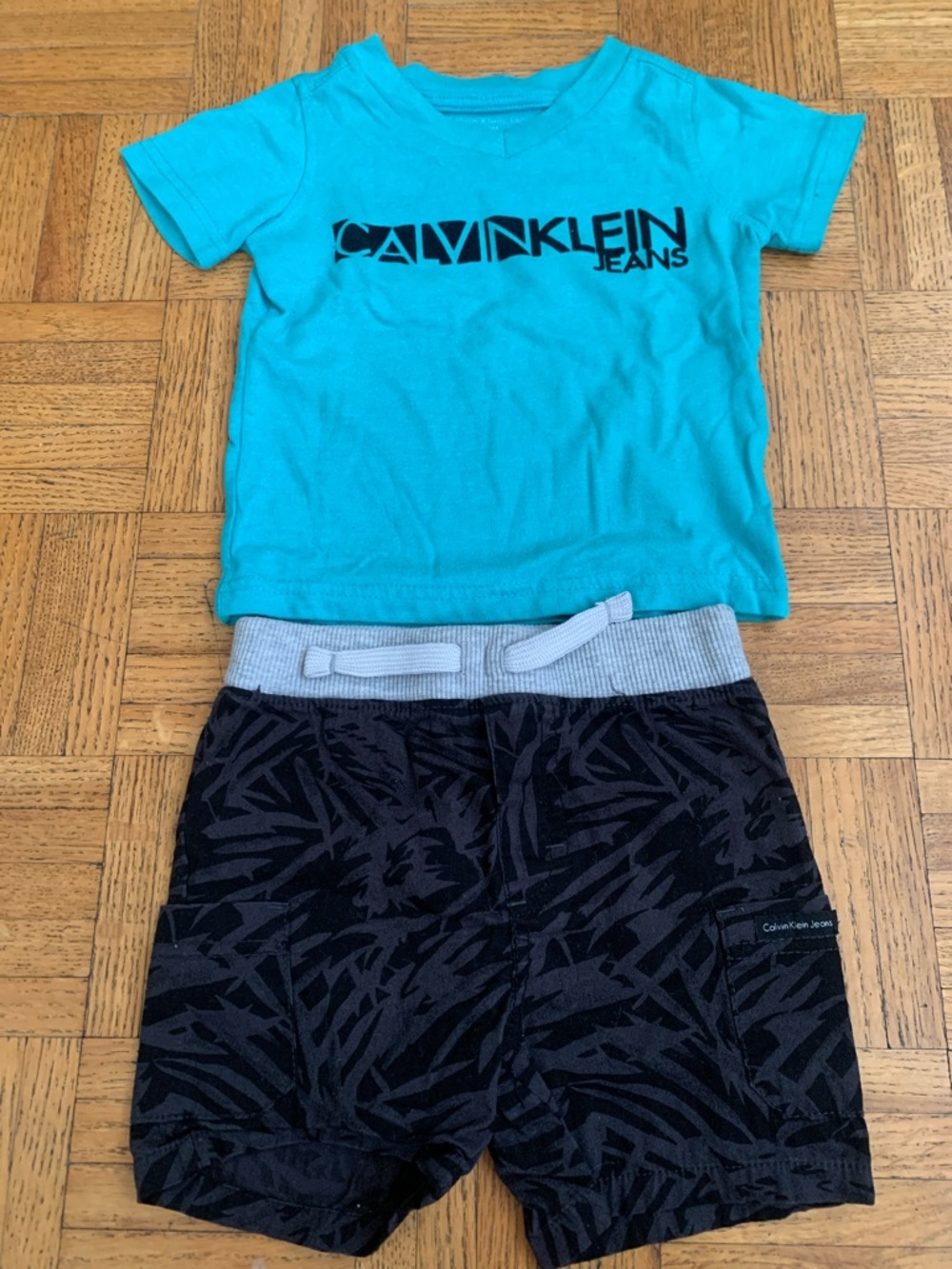 Calvin Klein Jeans Teal Logo Tee with Black Patterned Shorts